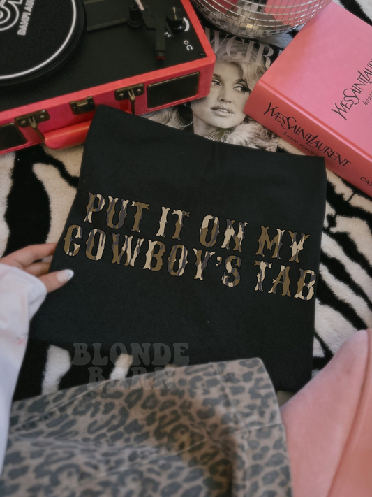 PUT IT ON MY COWBOY'S TAB BLACK TEE